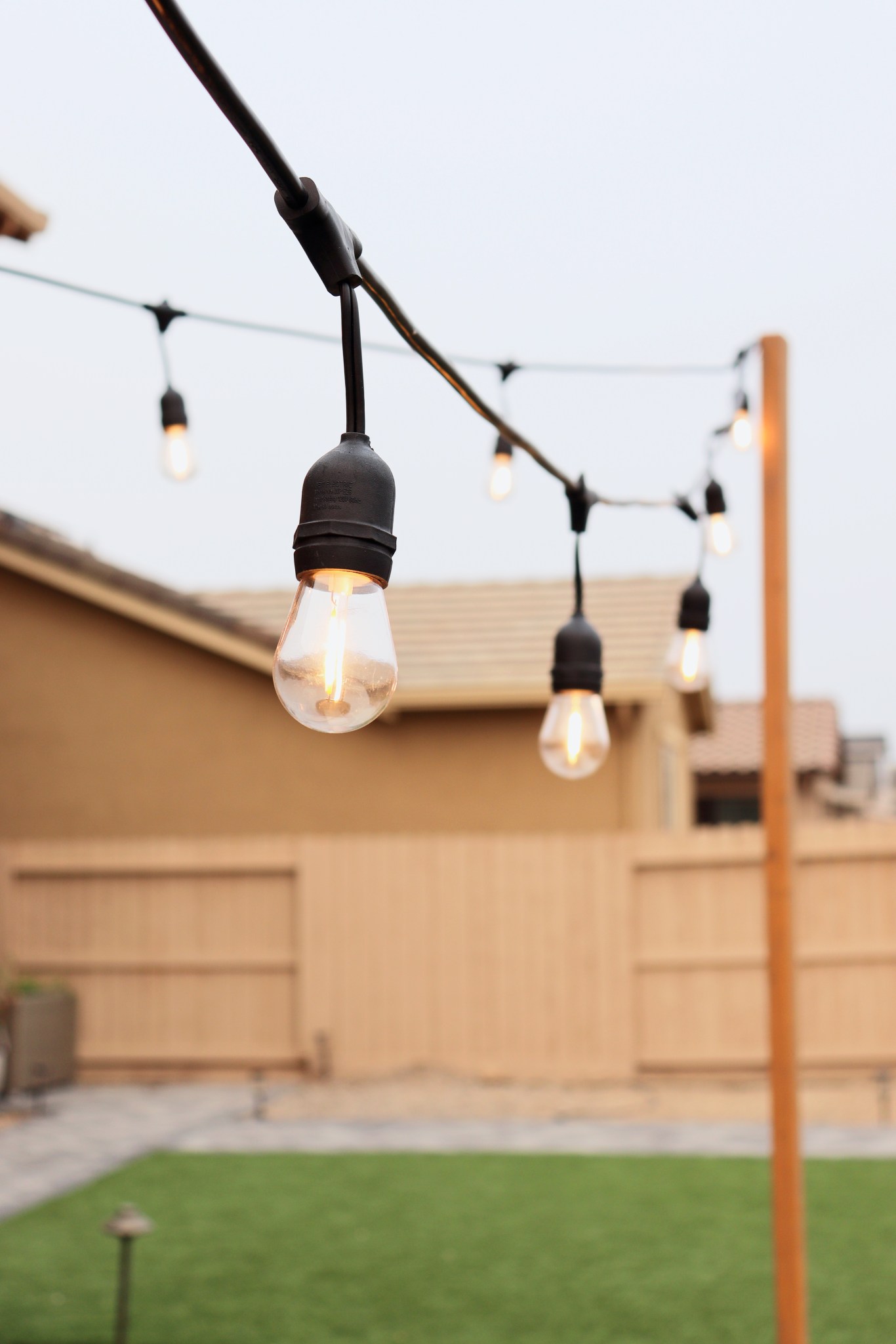 DIY String Light Posts – Home with Emily Jean